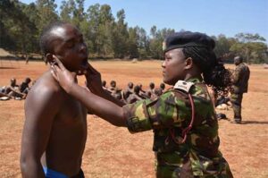 KDF officer checks on the physical fitness of a youth who turned for military recruitment at kaaga primary in Meru county