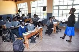 Teacher takes Junior Secondary School students at Primary School in , a public school,through an English lesson on February 2023